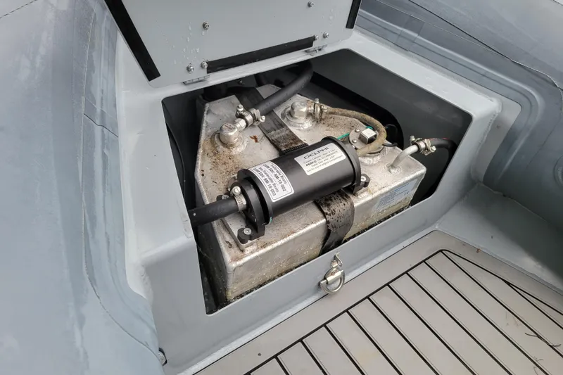 Slide: The Image of 2023 Highfield Sport 360 boat fuel tank compartment with visible connections. - 11