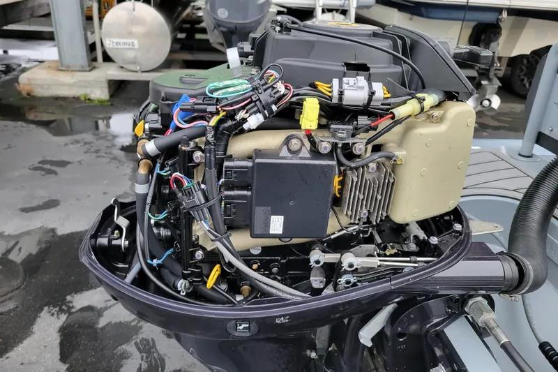 Slide: The Image of 2023 Highfield Sport 360 outboard motor with exposed engine components and wiring. - 20