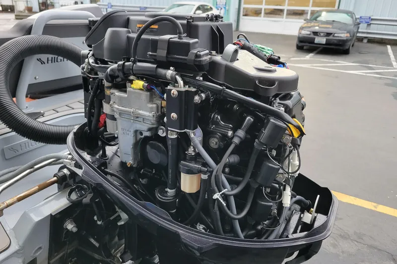 Slide: The Image of 2023 Highfield Sport 360 outboard motor, detailed view of engine components. - 21