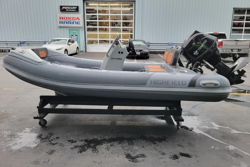 Slide: The Image of 2023 Highfield Sport 360 inflatable boat on display at a marine dealership. - 9