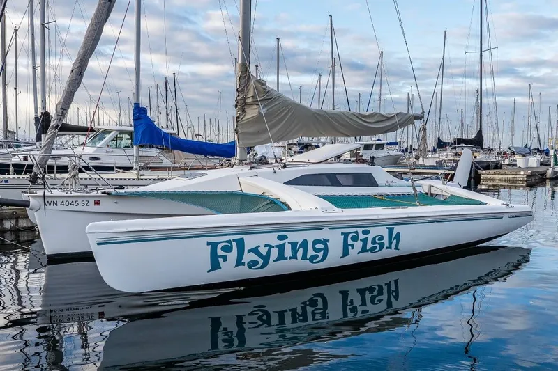 Slide: The Image of 2001 Corsair F-28 CC sailboat "Flying Fish" docked in a marina. - 10
