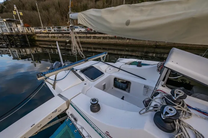 Slide: The Image of 2001 Corsair F-28 CC sailboat docked, showcasing deck and rigging details. - 15