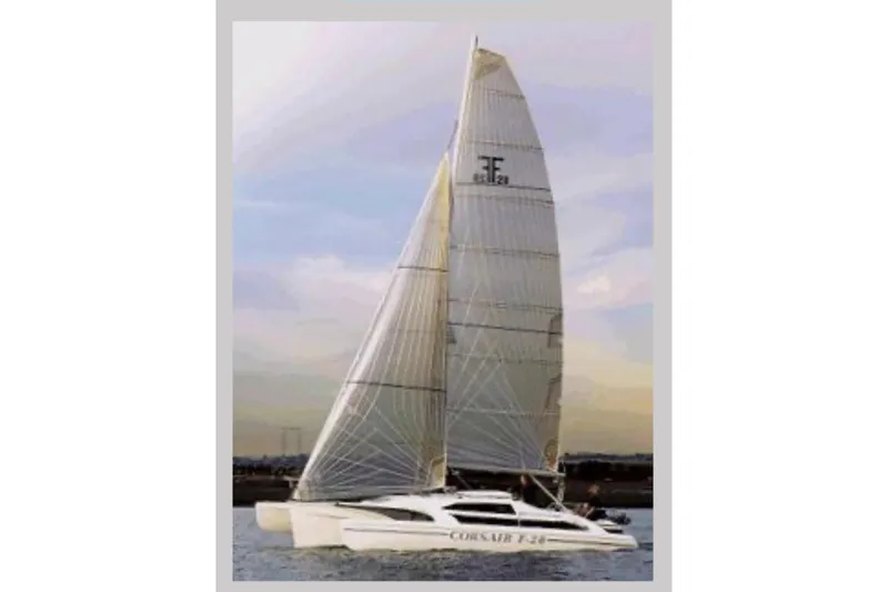 Slide: The Image of Sailing Corsair F-28 CC trimaran from 2001 on calm waters at sunset. - 2
