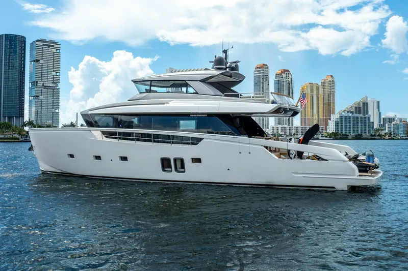 The Image of Sanlorenzo SX76 2021 yacht cruising near city skyline on a sunny day. - 0