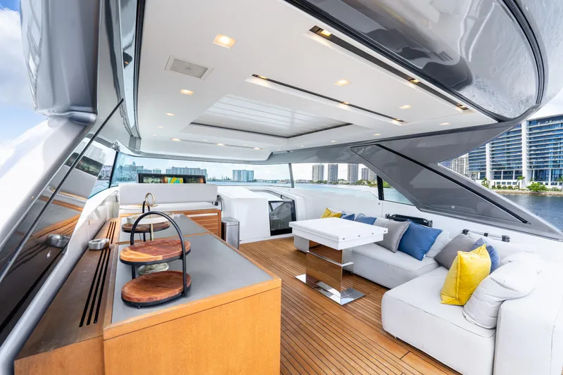 Slide: The Image of Luxurious 2021 Sanlorenzo SX76 yacht interior with modern seating and cityscape view. - 13