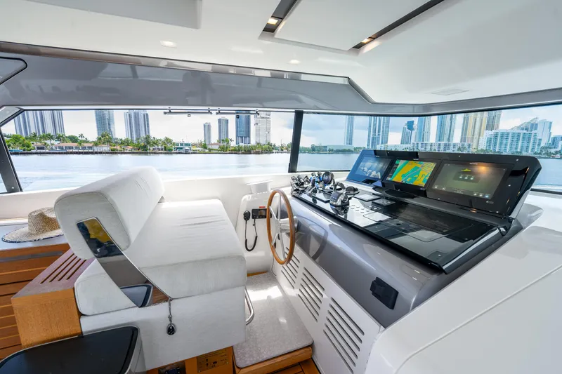Slide: The Image of Modern helm of 2021 Sanlorenzo SX76 yacht with city skyline view. - 16