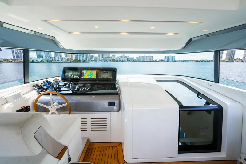 Slide: The Image of Helm of 2021 Sanlorenzo SX76 yacht with modern navigation equipment and panoramic views. - 19