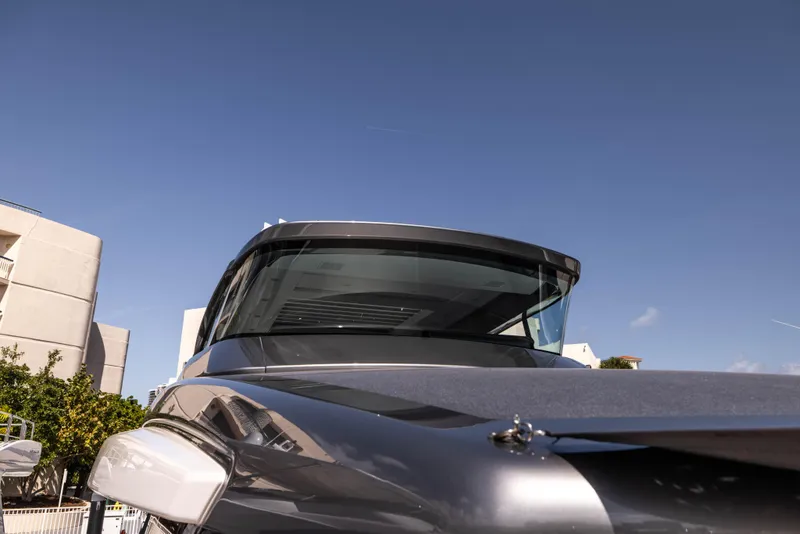 Slide: The Image of Sanlorenzo SX76 yacht, 2021 model, sleek design under clear blue sky. - 20