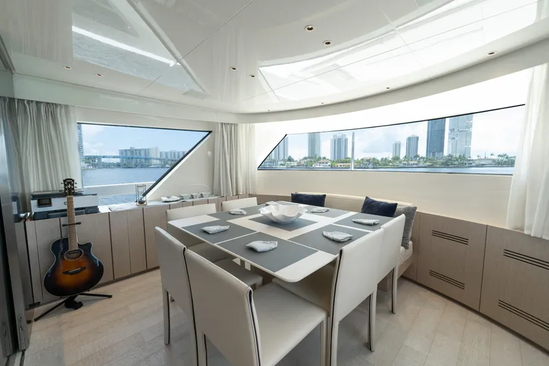 Slide: The Image of Luxurious dining area on 2021 Sanlorenzo SX76 yacht with cityscape view. - 26