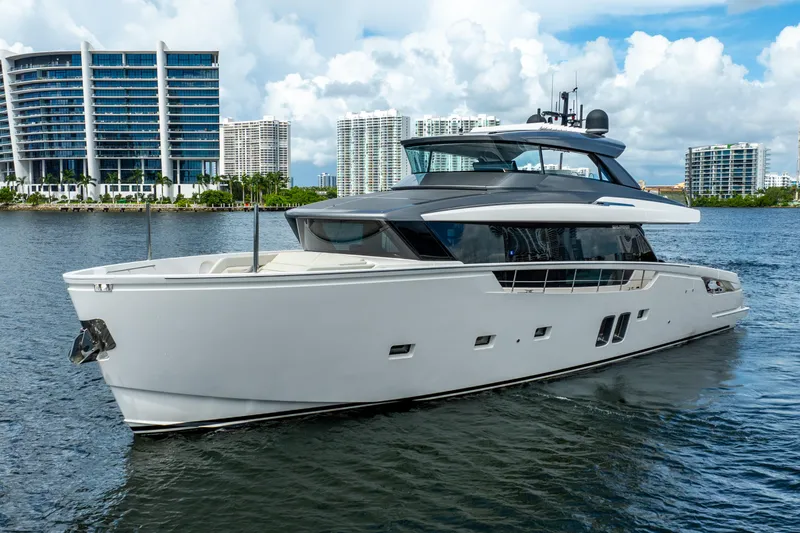 Slide: The Image of 2021 Sanlorenzo SX76 yacht cruising near modern city skyline. - 3