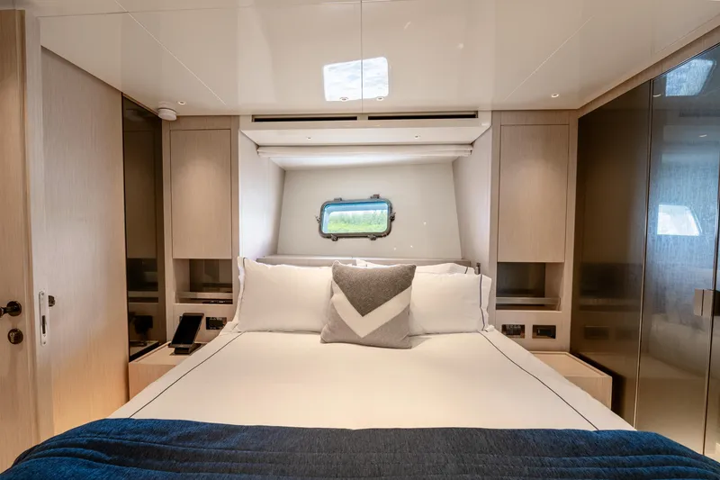 Slide: The Image of Luxurious bedroom interior of 2021 Sanlorenzo SX76 yacht with modern design and cozy bedding. - 38