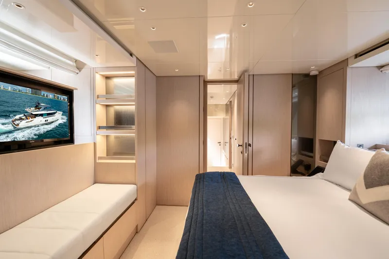 Slide: The Image of Luxurious Sanlorenzo SX76 2021 yacht bedroom with modern decor and flat-screen TV. - 39