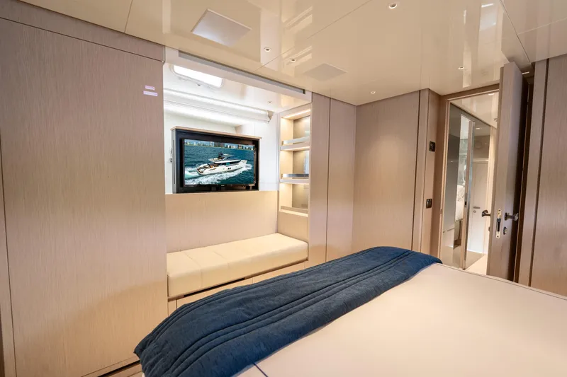 Slide: The Image of Luxurious Sanlorenzo SX76 2021 yacht bedroom with modern decor and TV. - 40