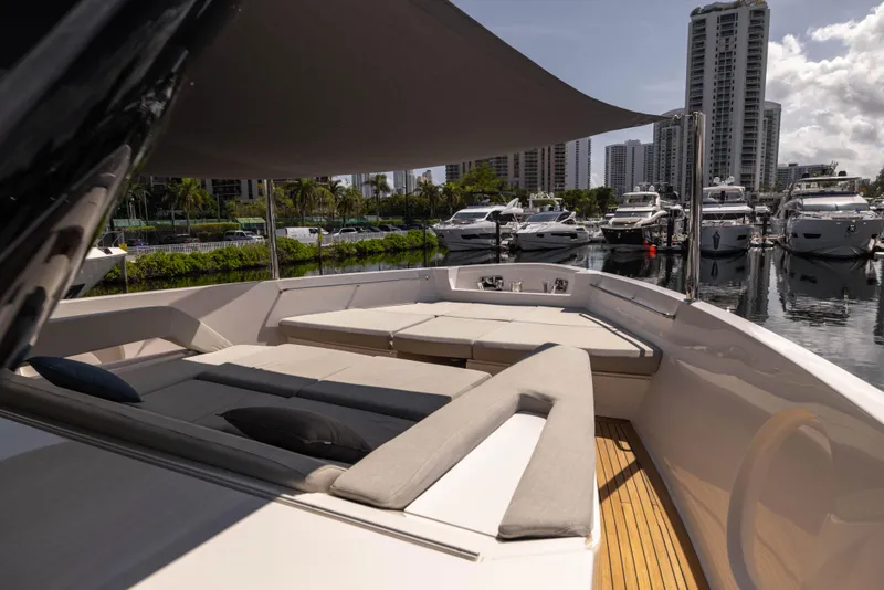 Slide: The Image of Luxurious 2021 Sanlorenzo SX76 yacht with spacious deck, docked in a marina. - 48