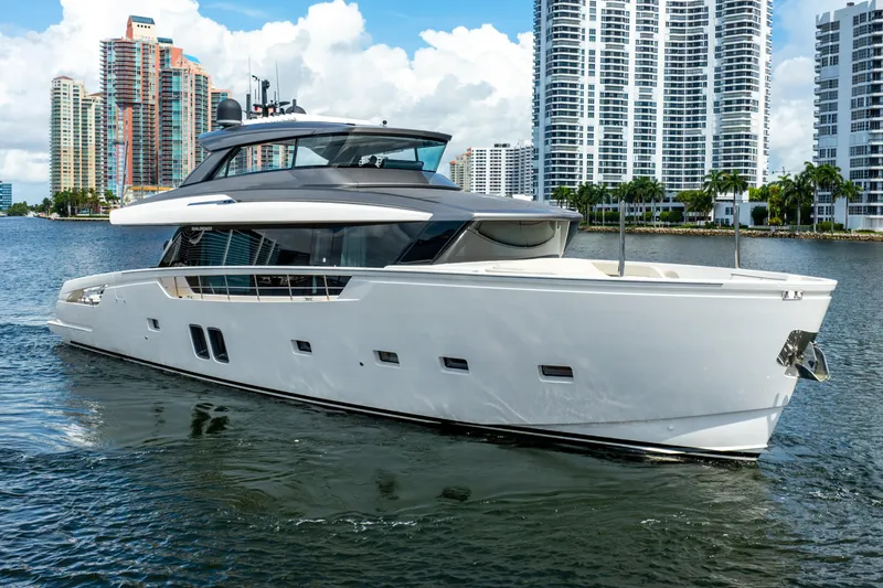 Slide: The Image of Sanlorenzo SX76 2021 yacht cruising near modern city skyline. - 5