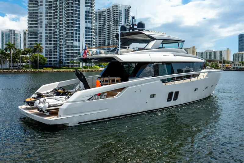 Slide: The Image of 2021 Sanlorenzo SX76 yacht cruising near modern city skyline. - 6
