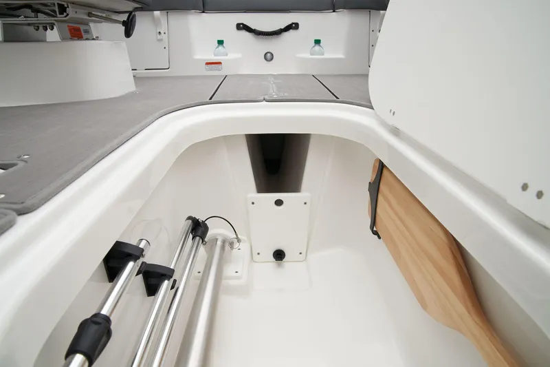 Slide: The Image of Manufacturer Provided Image: 2025 Tahoe T21 boat storage compartment with oars and equipment. - 17