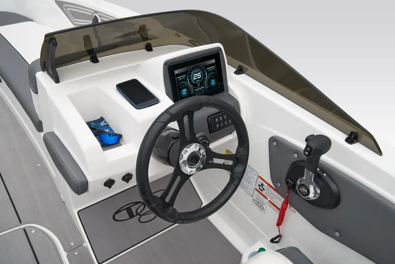Slide: The Image of Manufacturer Provided Image: 2025 Tahoe T21 boat dashboard with steering wheel, digital display, and control panel. - 20