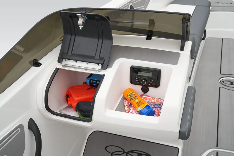 Slide: The Image of Manufacturer Provided Image: 2025 Tahoe T21 boat dashboard with storage compartments, sunscreen, and safety gear. - 27