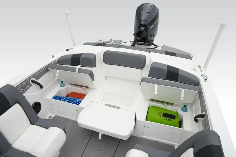 Slide: The Image of Manufacturer Provided Image: 2025 Tahoe T21 boat interior with seating, storage compartments, and outboard motor. - 35