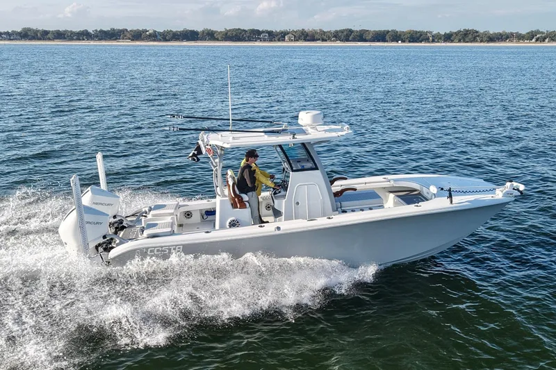 Slide: The Image of 2024 Costa Custom Boats 264 HC cruising on open water. - 14