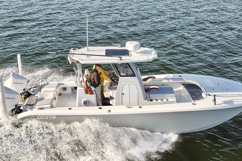 Slide: The Image of 2024 Costa Custom Boats 264 HC cruising on open water, showcasing sleek design and powerful engines. - 16