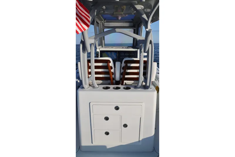 Slide: The Image of 2024 Costa Custom Boats 264 HC interior with seating and storage, featuring a sleek design. - 21