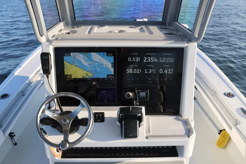 Slide: The Image of 2024 Costa Custom Boats 264 HC helm with advanced navigation displays and controls. - 22