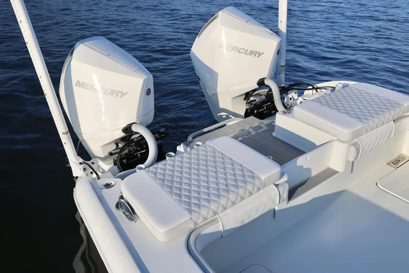 Slide: The Image of 2024 Costa Custom Boats 264 HC with dual Mercury engines on calm water. - 25