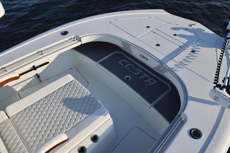 Slide: The Image of 2024 Costa Custom Boats 264 HC interior with quilted seating and sleek design. - 28