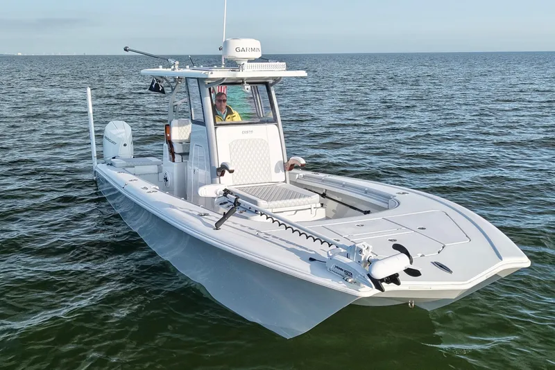 Slide: The Image of 2024 Costa Custom Boats 264 HC on open water, featuring advanced navigation equipment. - 5