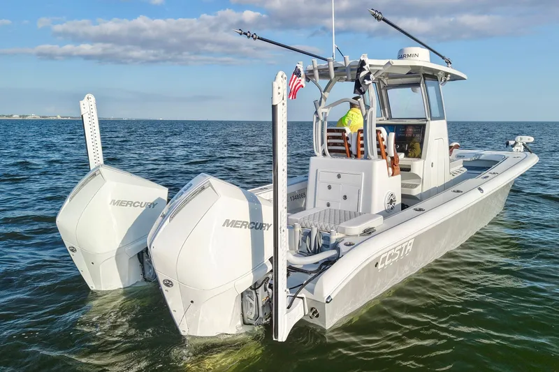 Slide: The Image of 2024 Costa Custom Boats 264 HC on water, featuring dual Mercury engines. - 6