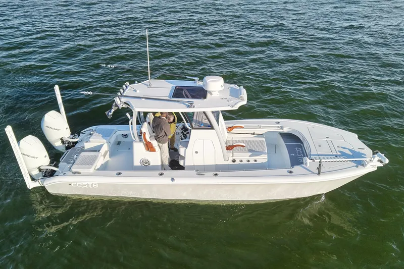 Slide: The Image of 2024 Costa Custom Boats 264 HC on water, featuring dual Mercury engines. - 9