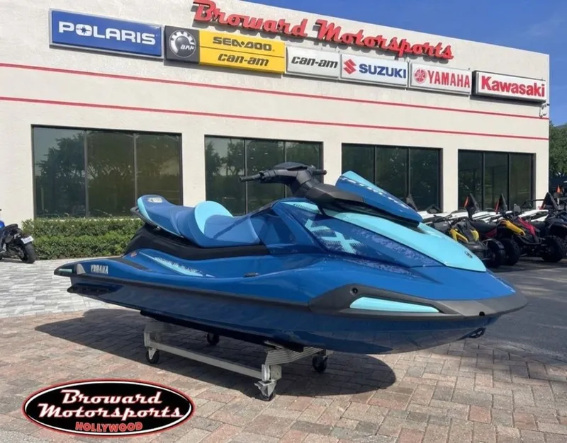 The Image of A blue 2026 Yamaha WaveRunner VX Cruiser® is displayed on a dolly outside a motorsports store. - 0