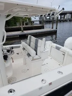 Slide: The Image of 2017 Everglades 255 Center Console boat at dock. - 12