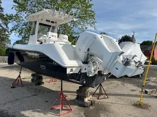 Slide: The Image of 2017 Everglades 255 Center Console boat elevated outdoors. - 5