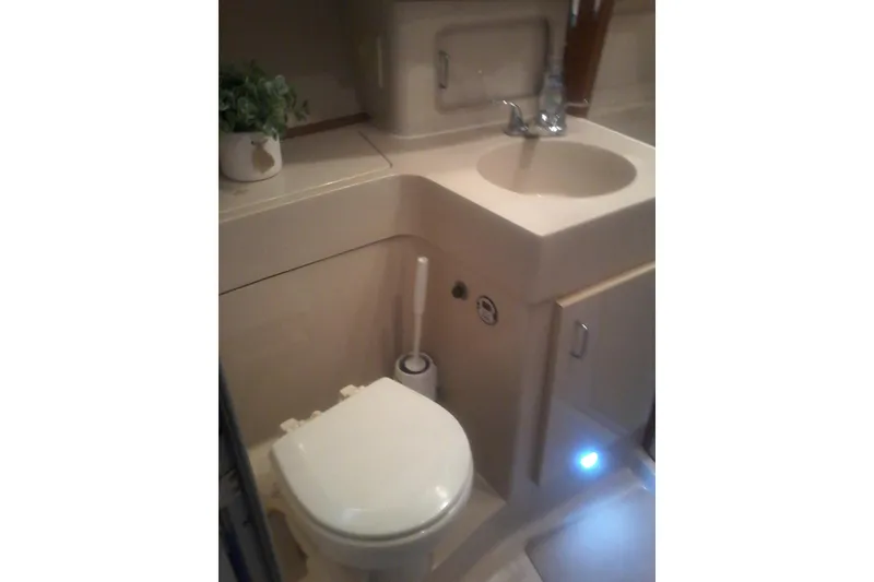Slide: The Image of Bathroom interior of 1997 Mainship 350 yacht with sink and toilet. - 39