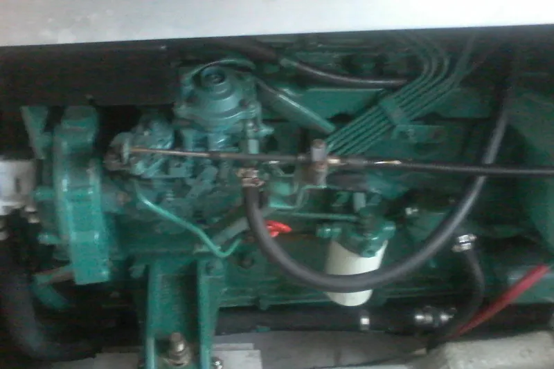 Slide: The Image of Engine of a 1997 Mainship 350 boat, showcasing mechanical components. - 42