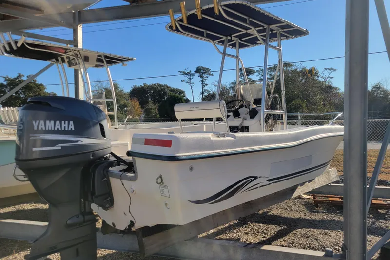 Slide: The Image of 2004 Palm Beach 1860 boat with Yamaha outboard motor on display. - 2