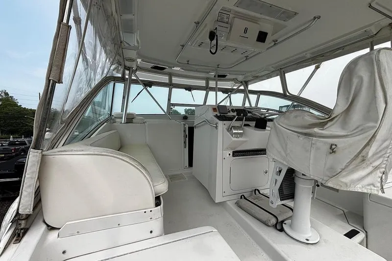 Slide: The Image of 2002 Luhrs 40 Open boat cockpit with helm, seating, and controls. - 10