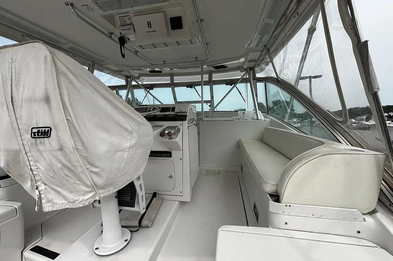 Slide: The Image of 2002 Luhrs 40 Open boat interior with helm and seating area. - 11