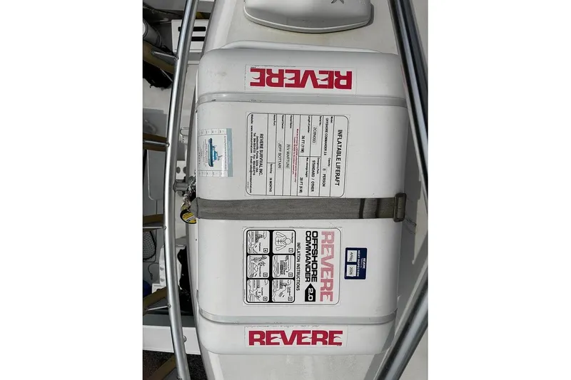 Slide: The Image of Inflatable liferaft on 2002 Luhrs 40 Open boat, labeled "Revere Offshore Commander 40." - 19