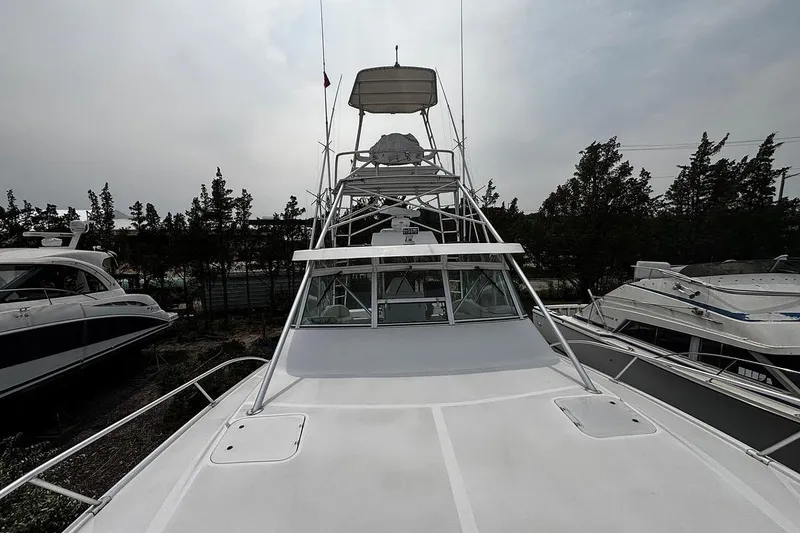 Slide: The Image of 2002 Luhrs 40 Open boat with tower, docked among other vessels. - 22