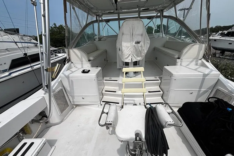 Slide: The Image of 2002 Luhrs 40 Open boat interior with seating, helm, and fishing equipment. - 26