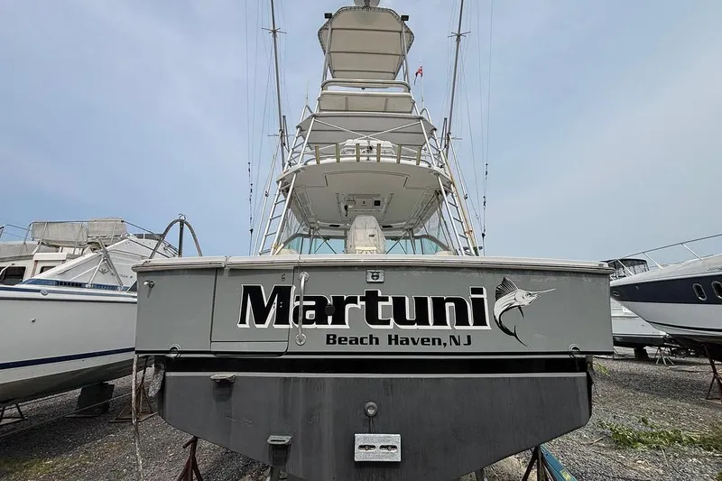 Slide: The Image of 2002 Luhrs 40 Open boat named "Martuni" in Beach Haven, NJ, docked on land. - 27