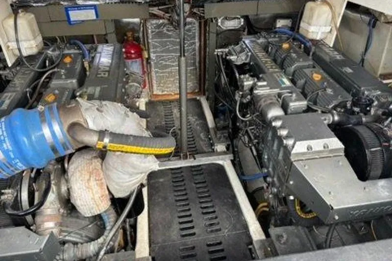 Slide: The Image of Engine room of a 2002 Luhrs 40 Open boat, featuring dual Yanmar engines. - 36
