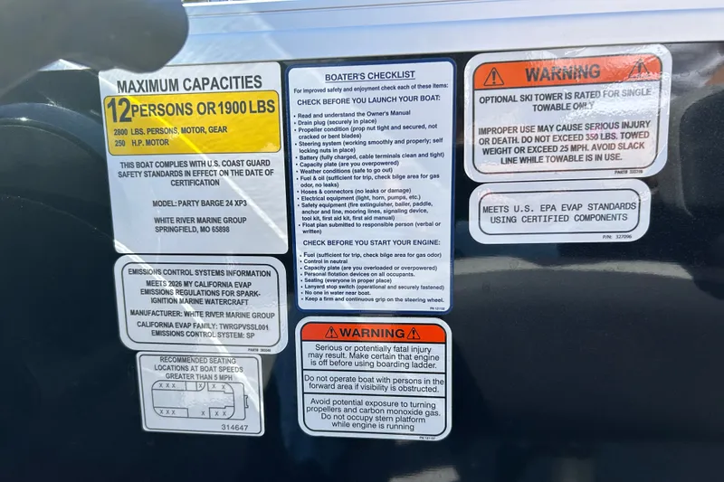 Slide: The Image of 2026 Sun Tracker Party Barge 24 XP3 capacity and safety warnings label. - 21
