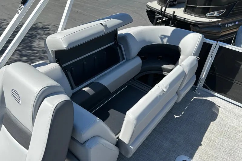 Slide: The Image of 2026 Sun Tracker Party Barge 24 XP3 with spacious seating and storage compartments. - 13