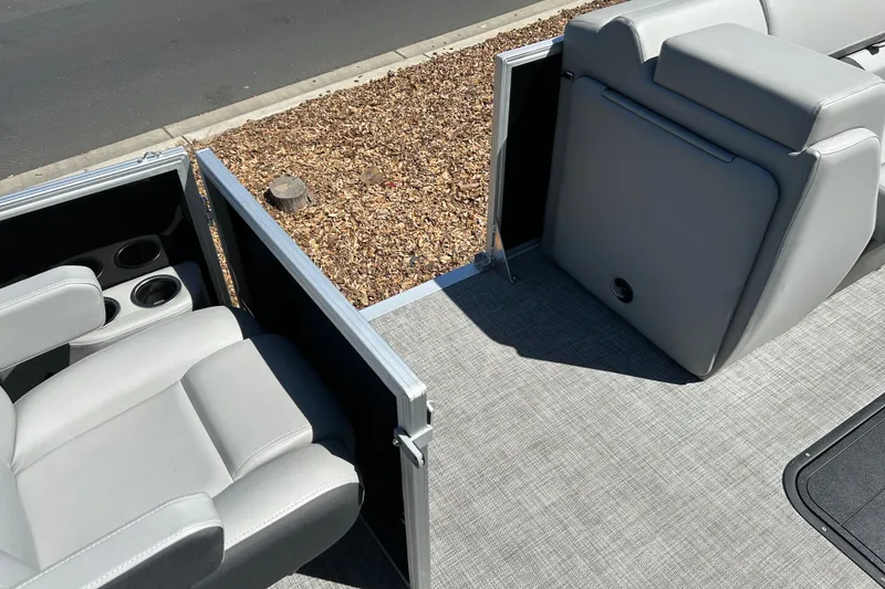 Slide: The Image of 2026 Sun Tracker Party Barge 24 XP3 interior with gray seating and cup holders. - 19