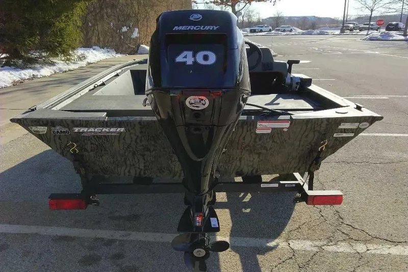 Slide: The Image of 2026 Tracker Grizzly 1648 SC boat with Mercury 40 engine in parking lot. - 6
